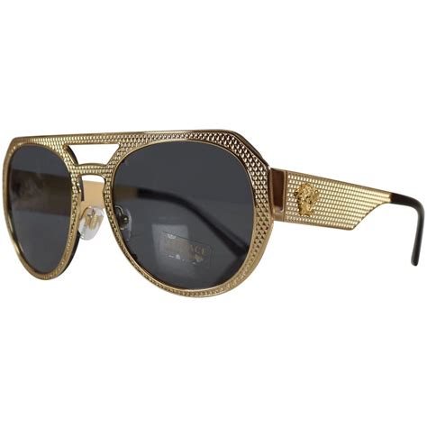 gold frame versace shades.